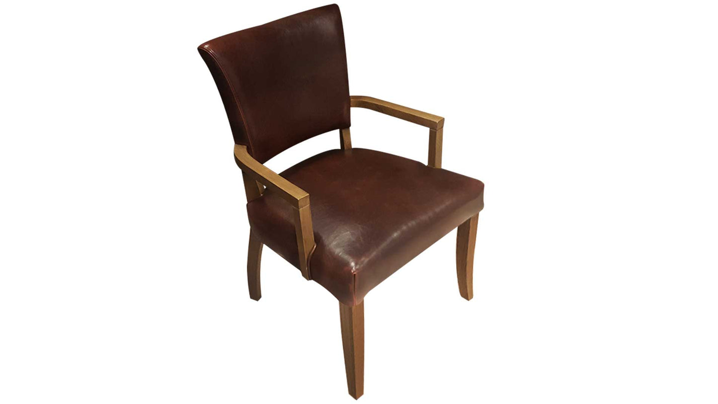 brown leather upholstered dining chair with arms